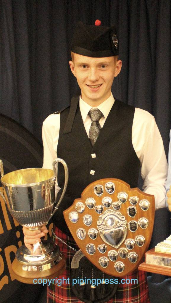 Champion Piper Donald Stewart with his trophies