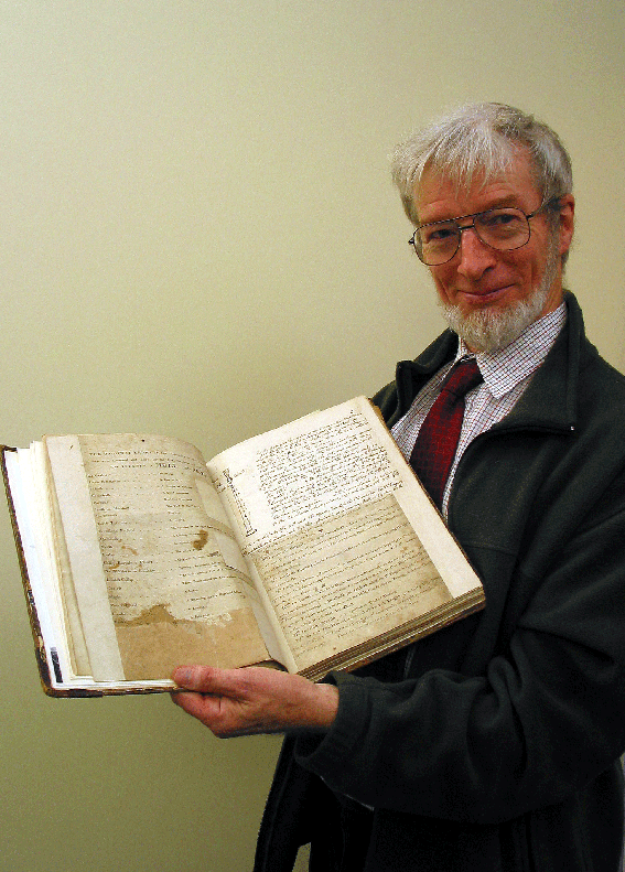 In his element...the late Professor Roderick Cannon with an ancient piping manuscript 