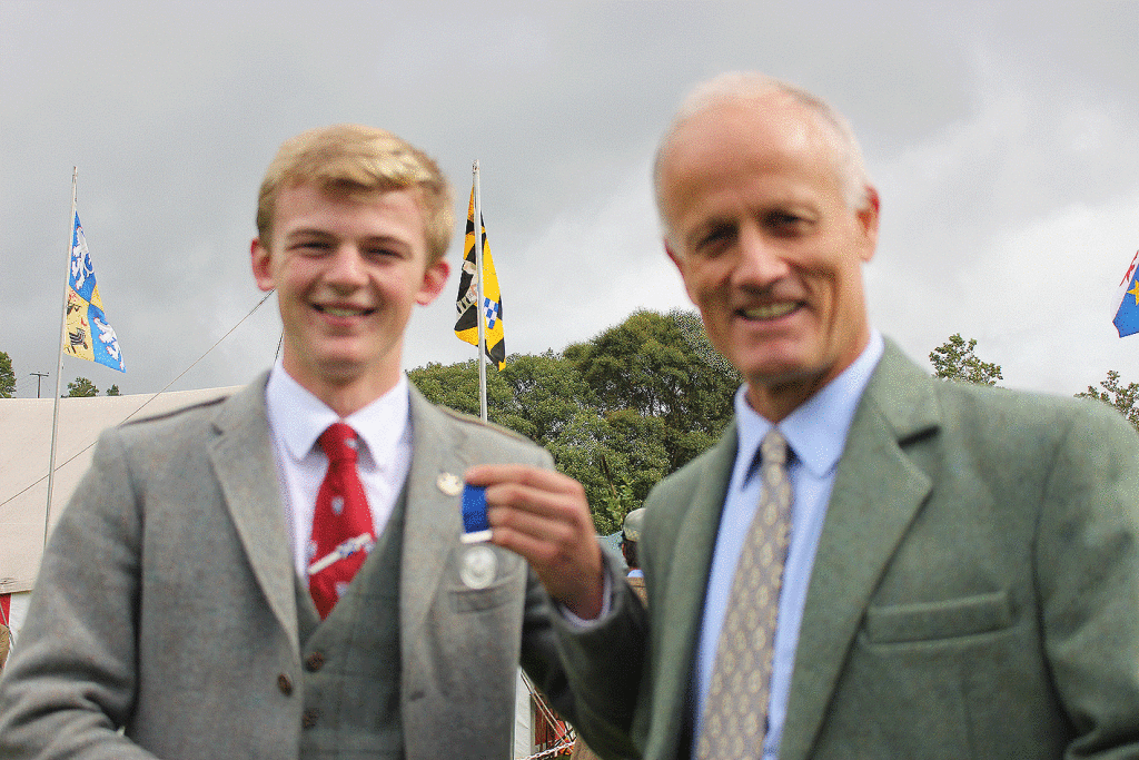 Sandy Cameron receives his medal from John Campbell of Kilberry, sponsor of the event