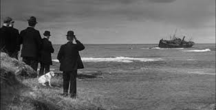 A scene from 'Whisky Galore'....islanders look on as the SS Politician and her golden cargo founders