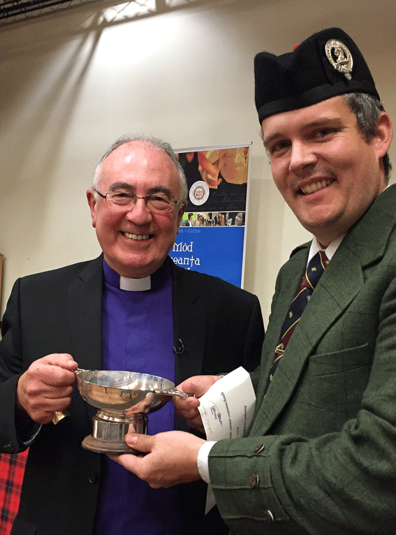 H&J winner Decker Forrest receives his trophy from the Rev Dr Morrison