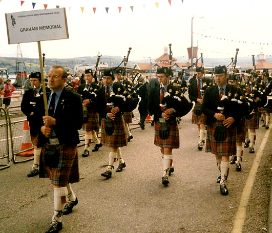 Graham Memorial president Tom McCarroll leading the band 'up the road' at Cowal. P/M Lenny Browne is to Tom's right