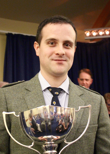 Finlay Johnston with the March, Strathspey and Reel trophy