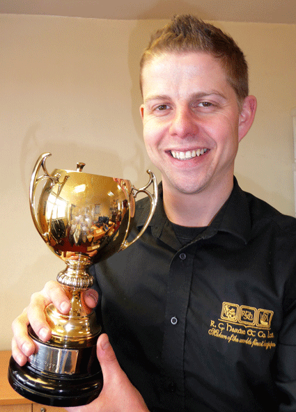RG Hardie Man aging Director Alastair Dunn with the new trophy his company has sponsored 