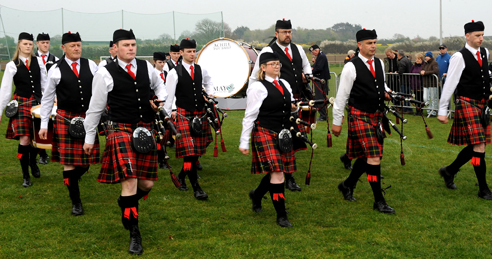 Pipe Major Conor Molloy (left) and champions Achill Pipe Band, Co Mayo 