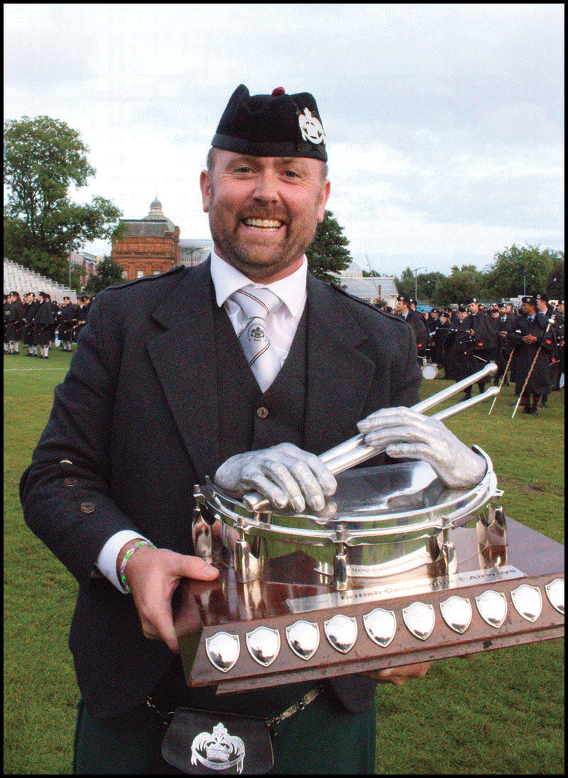SLoT leading tip Stephen Creighton with the World Drum Corps Champiopnship trophy