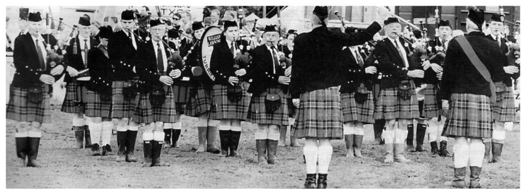 Turriff Pipe Band under the late P/M Bill Hepburn showed how to combat a quagmire...no worries over laces and brogues here