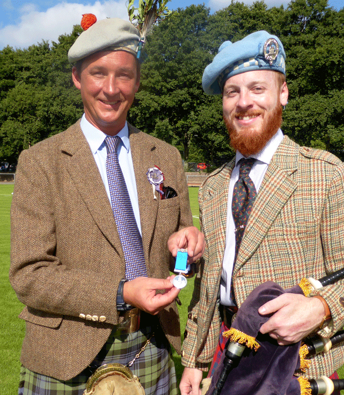Nick receives his medal from His Grace the Dook of Argyll